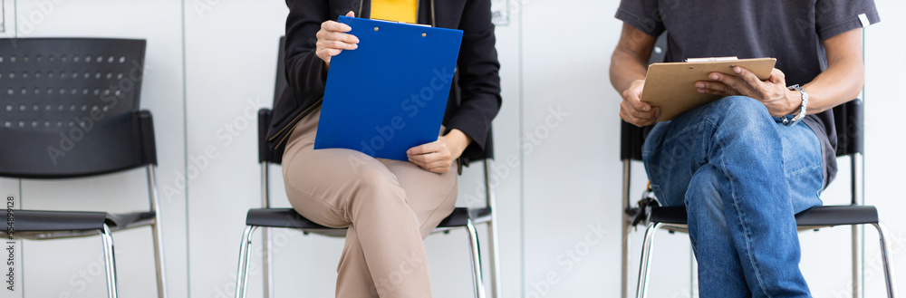 Group of applicants while waiting for a job interview.