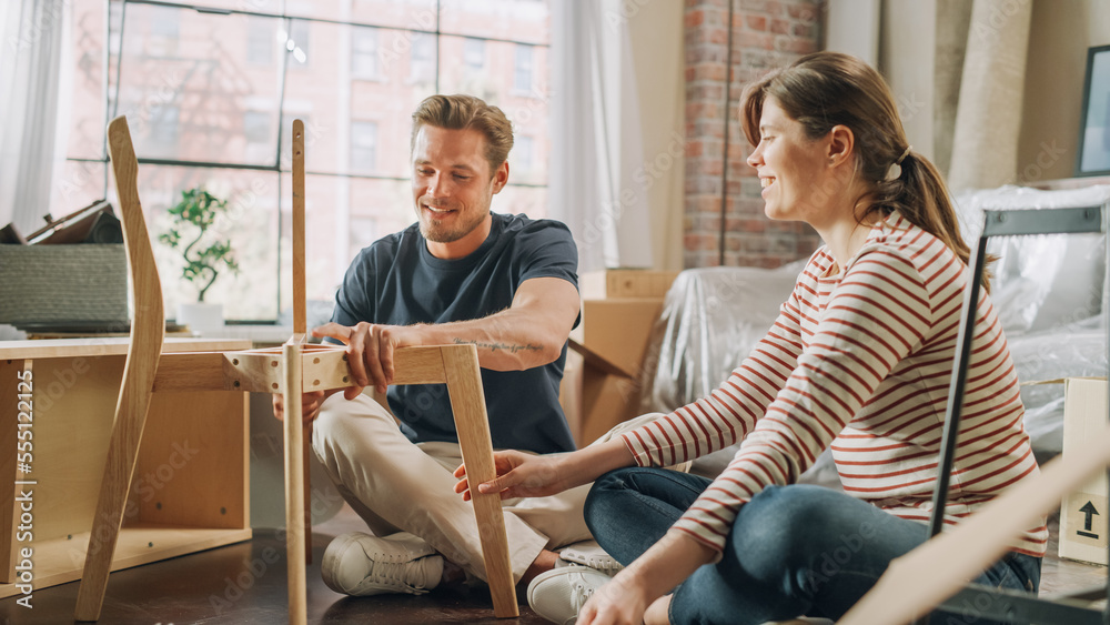 Family Moving in and Home Renovations: Happy Couple Assembles Furniture Together, Girlfriend Reads I