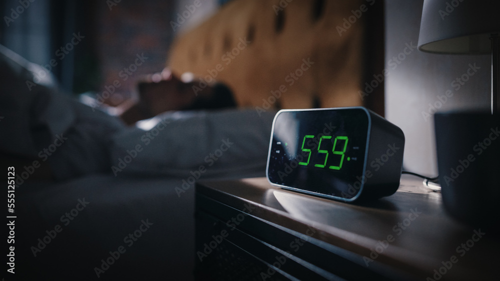 Handsome Man Wakes Up and Turns off Alarm Clock. Proceeds to Have a Productive Day of Work. Stylish 