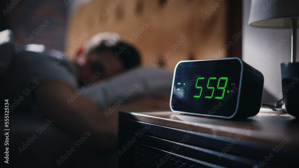 Handsome Man Wakes Up and Turns off Alarm Clock. Proceeds to Have a Productive Day of Work. Stylish 