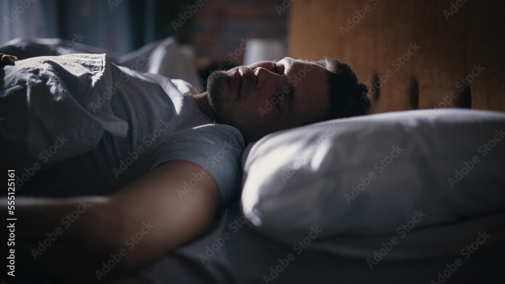 Top View Apartment Bedroom: Handsome Young Man Sleeping Cozily on a Bed in His Bedroom at Night. Com