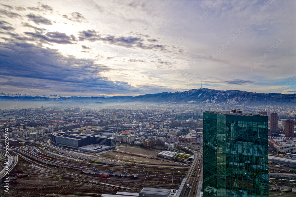 Aerial view of City of Zürich seen from industrial district with skyscraper and local mountain Uetli