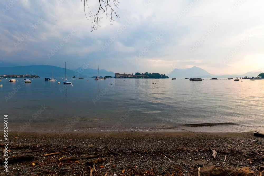 Mountain lake shore and hills in Italy