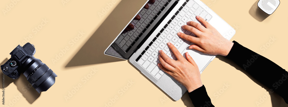 Laptop computer with a SLR camera from above