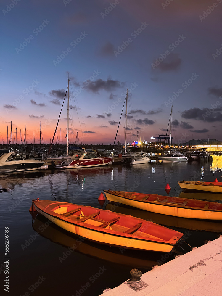 Small yacht in dock on warm evening