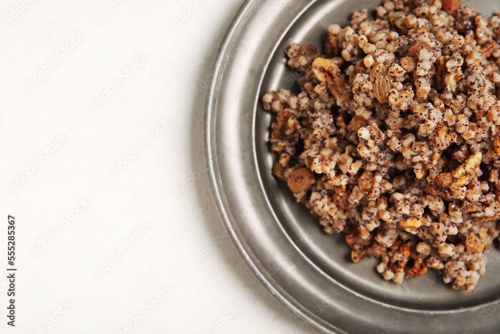 Plate of Kutya on white background, closeup