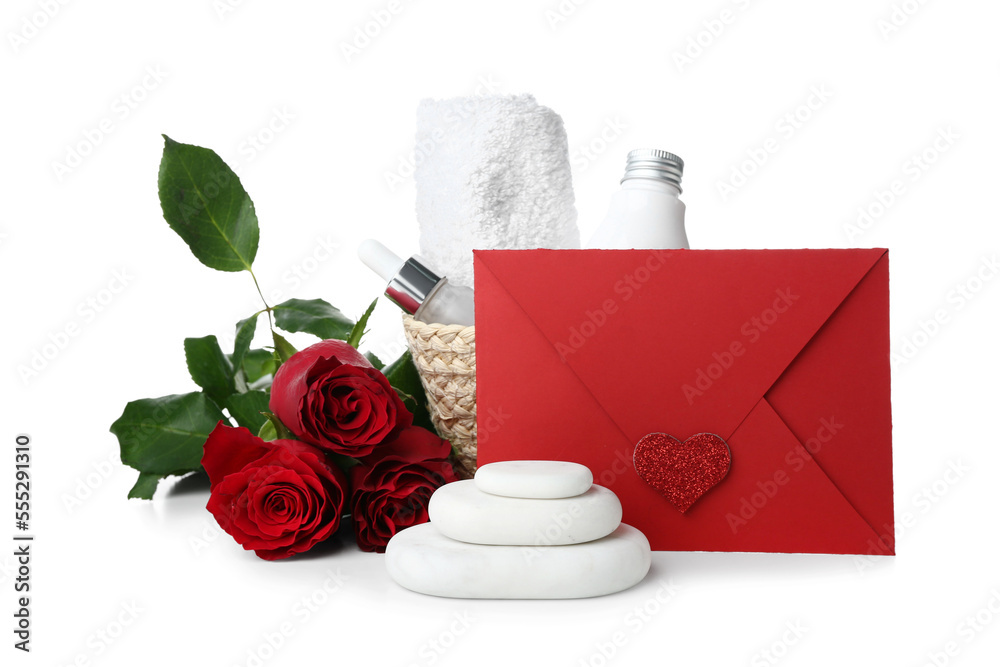 Beautiful spa composition for Valentines Day with flowers, stones and envelope on white background