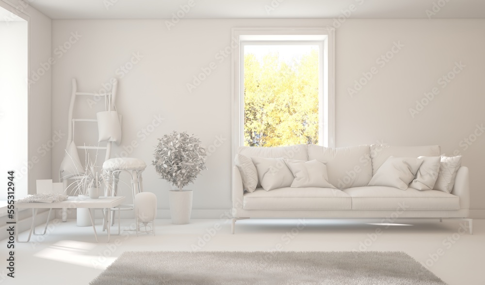 Stylish room in white color with sofa and autumn landscape in window. Scandinavian interior design. 