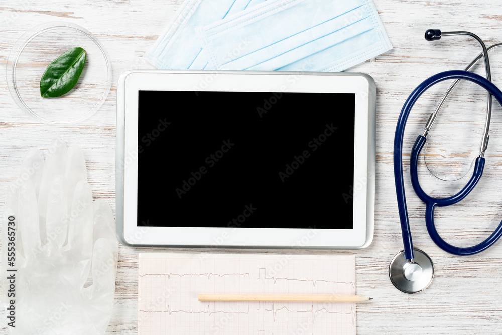 Mock up of doctors desktop with medical supplies