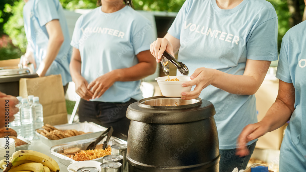 Humanitarian Organization: Close Up of Volunteers Preparing Free Meals and Feeding Local Community t