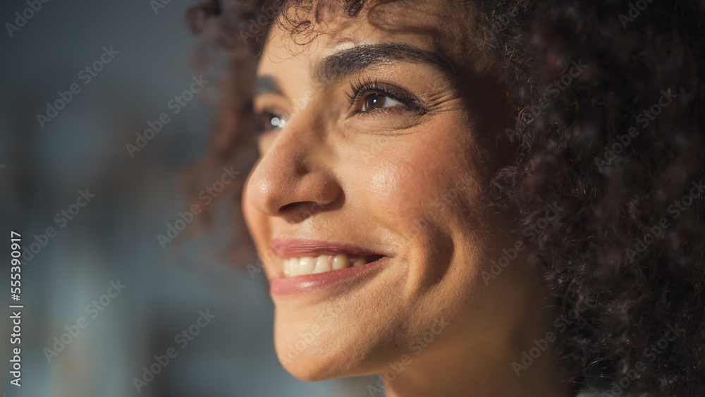 Close Up Portrait of a Multiethnic Brunette with Curly Hair and Brown Eyes. Happy Creative Young Wom