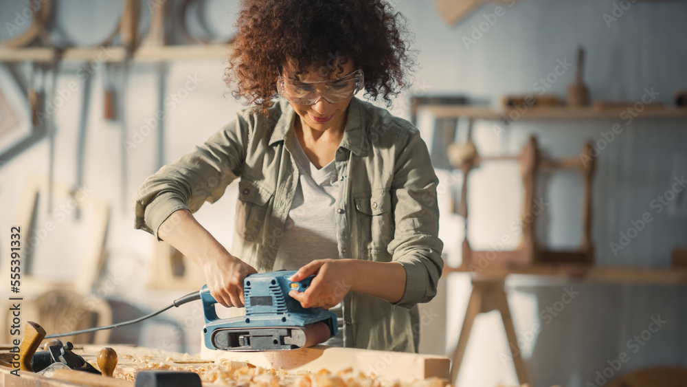 Portrait of a Talented Beautiful Artisan Carpenter Using Electric Sanding Machine to Polish a Wood B