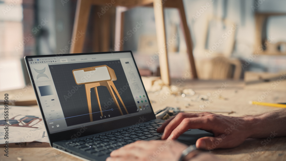 Handsome Furniture Designer Working on Laptop Computer, Creating a Digital 3D Model of a Stylish Woo