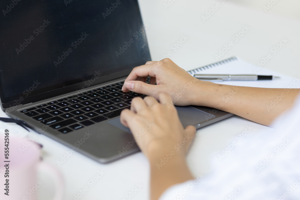 Business woman working on laptop, modern accounting concepts.