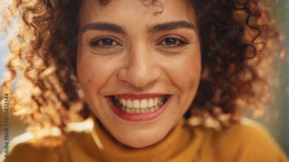 Close Up Portrait of a Young Middle Eastern Woman with Short Curly Hair, Looking for Camera, Wearing