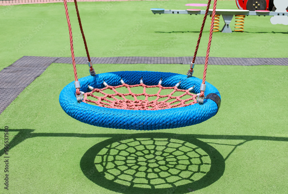 View of childrens playground with nest swing