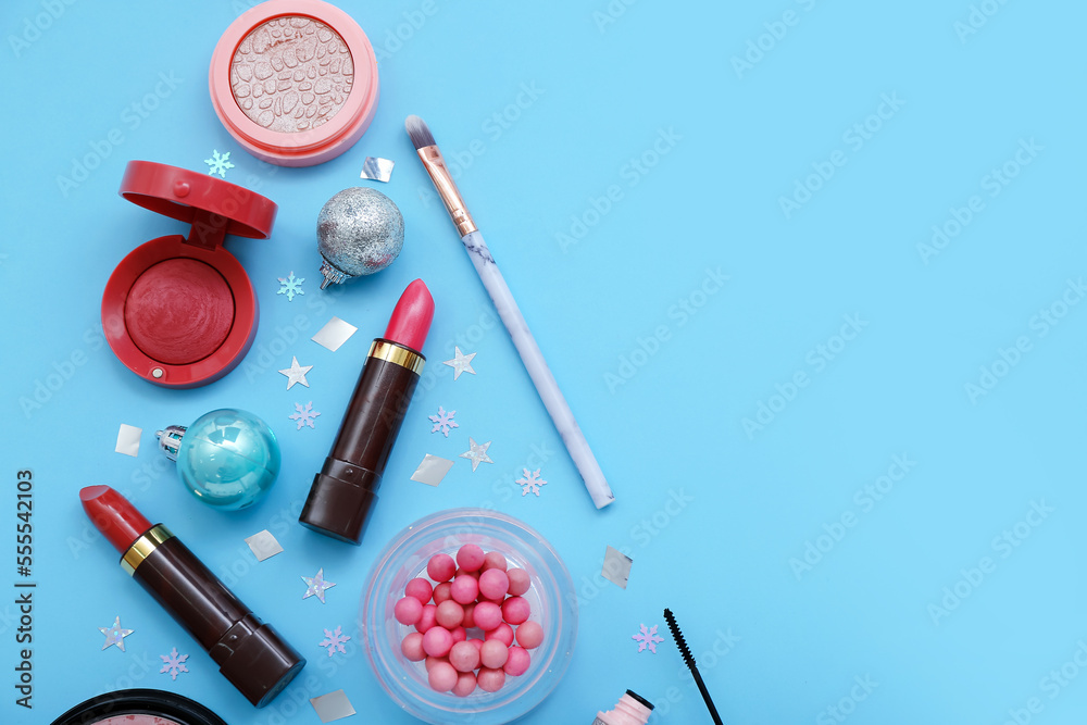 Composition with different cosmetics and decorations on color background