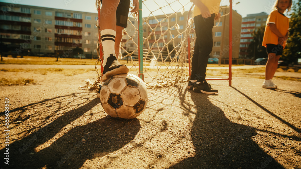 Close Up Shot : Young Boy Stopping a Ball with his Foot. Young Football Players Getting Ready to Sta