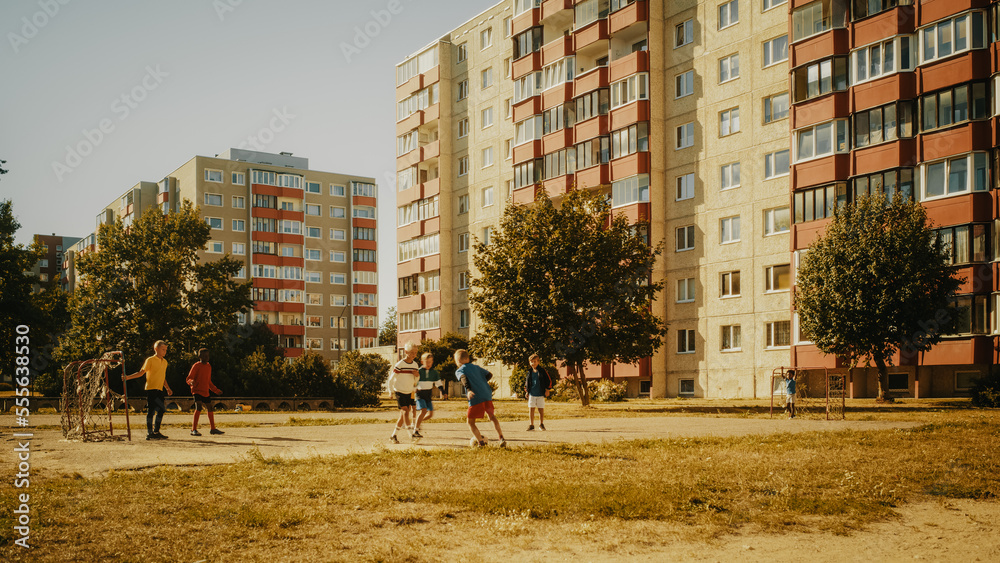 Neighborhood Kids Playing Soccer in the Hood. Young Football Player Dribbling and Scoring a Fascinat