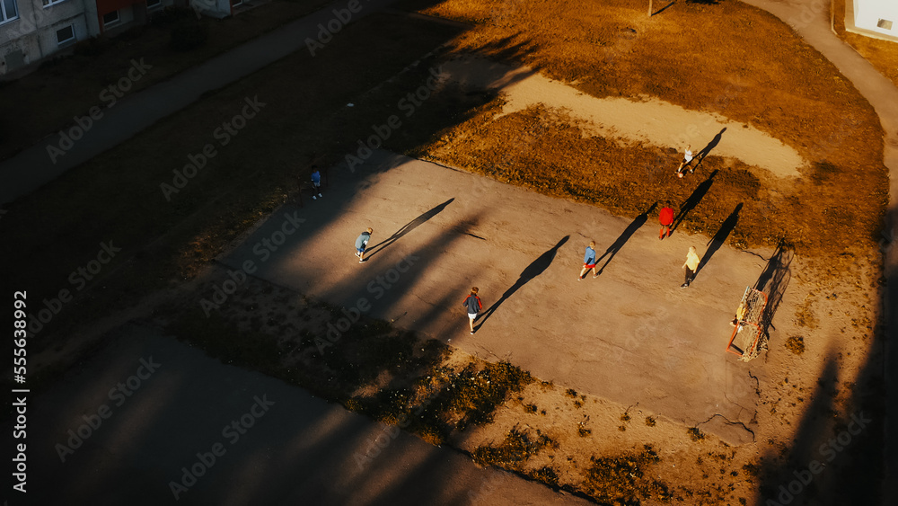 Aerial Shot of Talented Multiethnic Diverse Kids Playing Soccer in Their Backyard on a Sunny Day in 