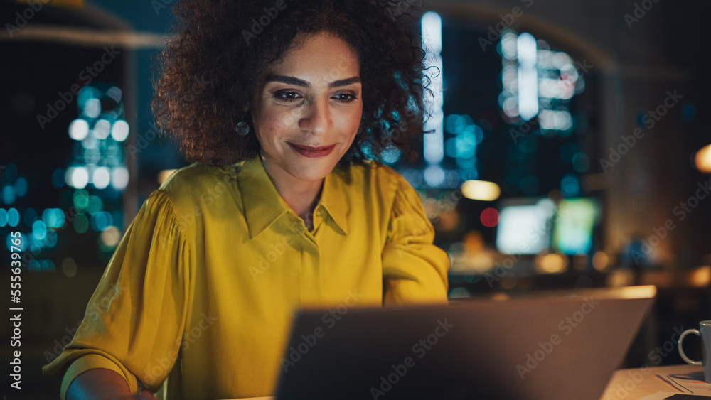 Close Up Portrait of a Happy Multiethnic Manager Sitting at a Desk in Creative Office. Young Stylish