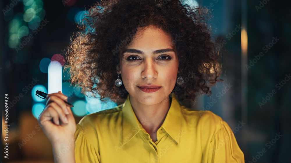 Close Up Portrait of a Happy Middle Eastern Manager Sitting at a Desk in Creative Office. Young Styl