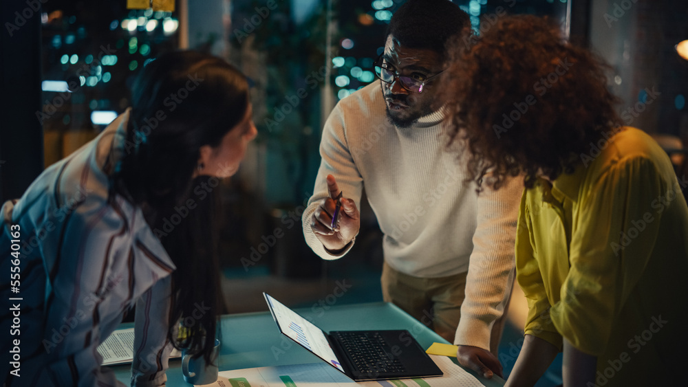 Close Up on a Group of Young Successful Businesspeople Making a Team Meeting in Conference Room in C