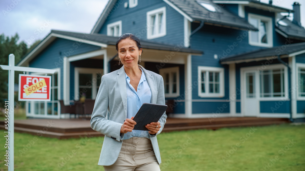 Portrait of an Attractive Middle Aged Real Estate Agent Holding Tablet Computer, Posing for Camera a