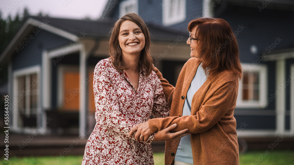 Portrait of a Happy Young Pregnant Female Standing Together with Her Senior Mother or Grandparent. F