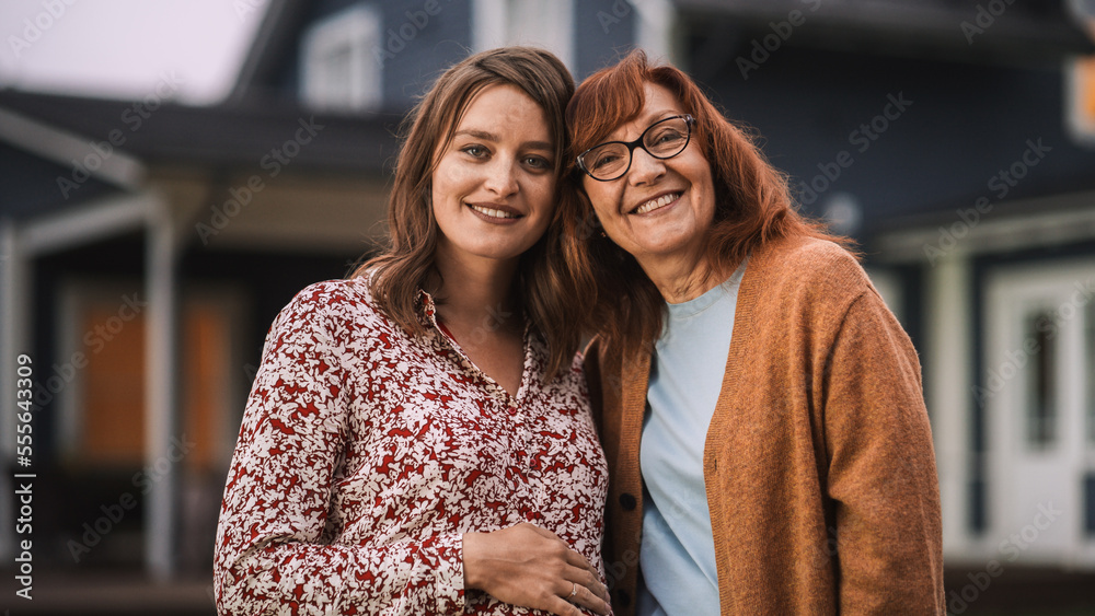 Portrait of a Cheerful Beautiful Female Standing Together with Her Senior Mother or Grandparent. You