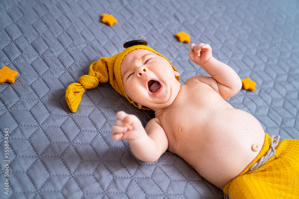 Portrait of a newborn baby boy. Little baby in gnome costume.