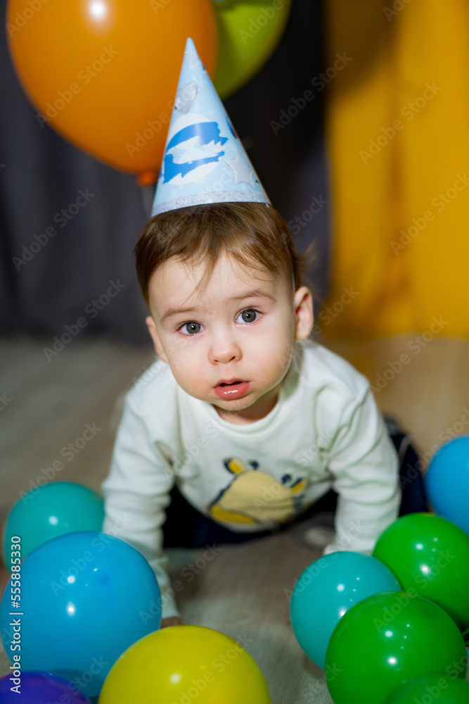 Babies First Birthday. One year old with colorful balloons. The boys birthday.