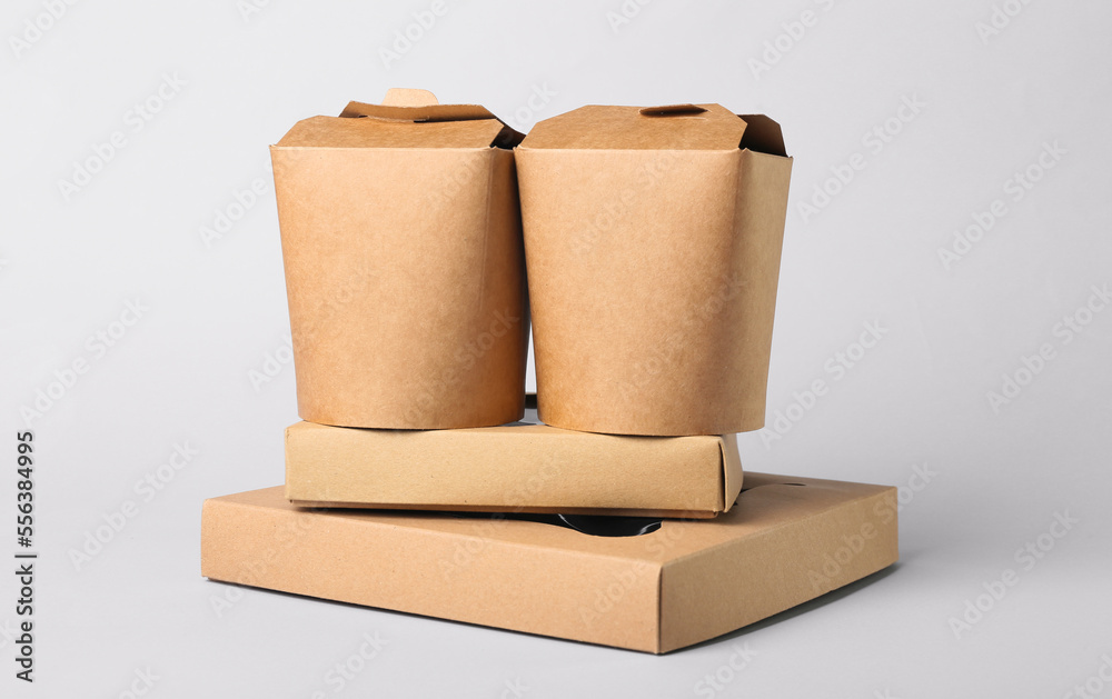 Set of different food boxes on light background