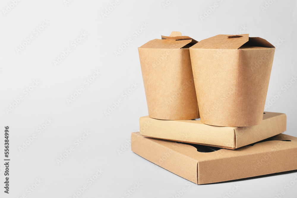 Set of different food boxes on light background