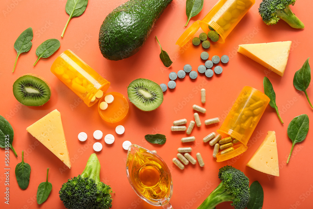 Composition with healthy products and pills on orange background