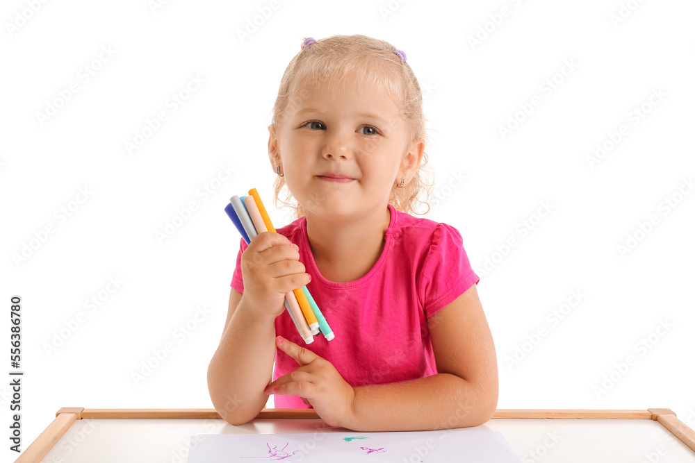 Cute little girl with felt-tip pens at table on white background