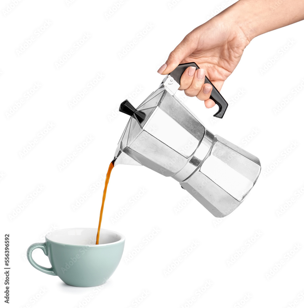 Woman pouring espresso from geyser coffee maker into cup on white background