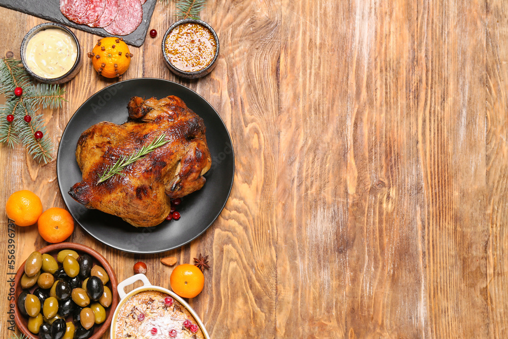 Christmas table setting with tasty meat on wooden background