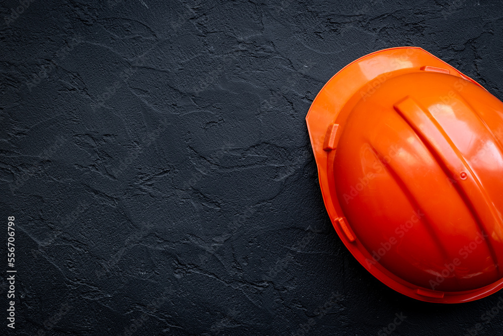 Engineer safety helmet overhead view. Construction background