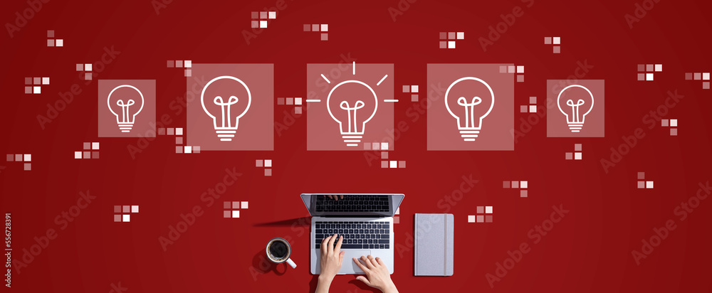 Idea light bulb theme with person working with a laptop