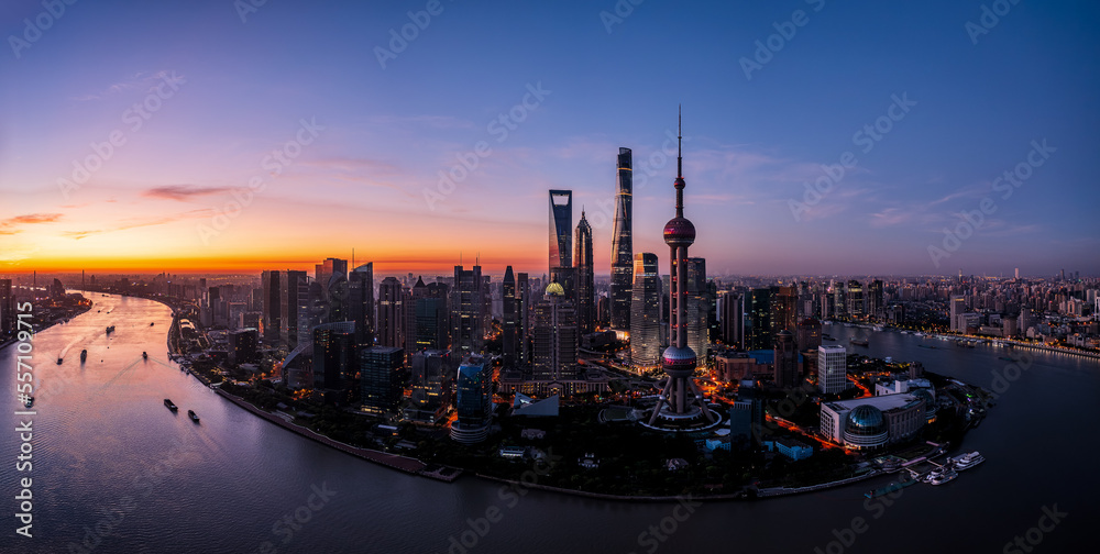 Aerial view of city skyline and modern buildings in Shanghai at sunrise, China.