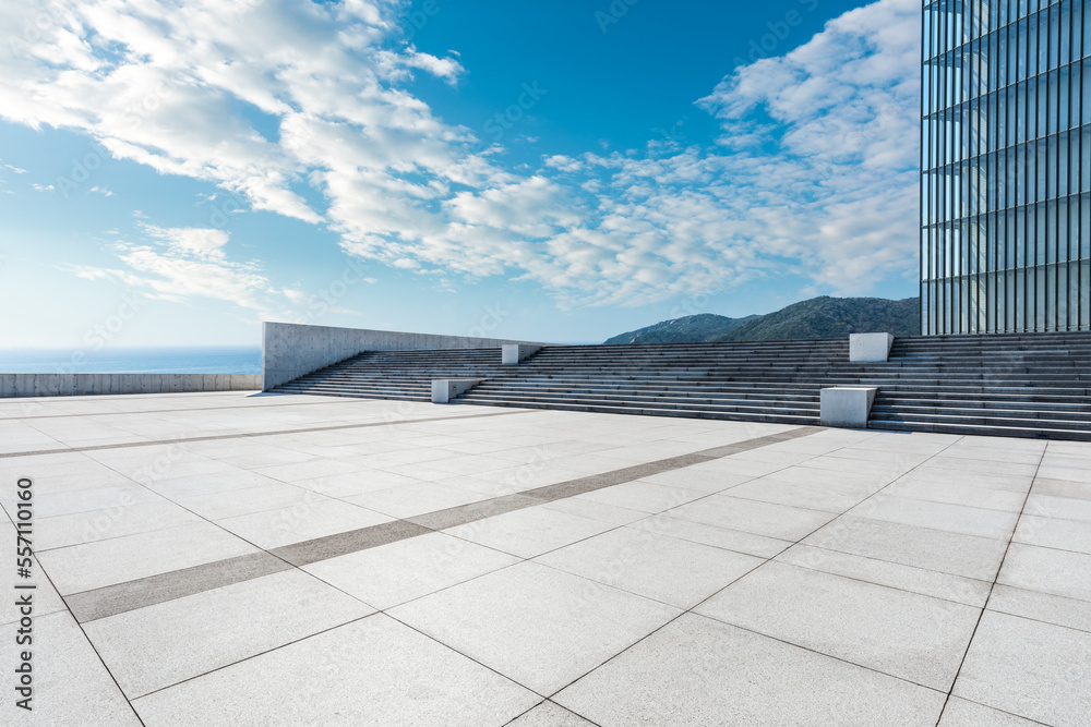 Empty square floor and lake with mountain background