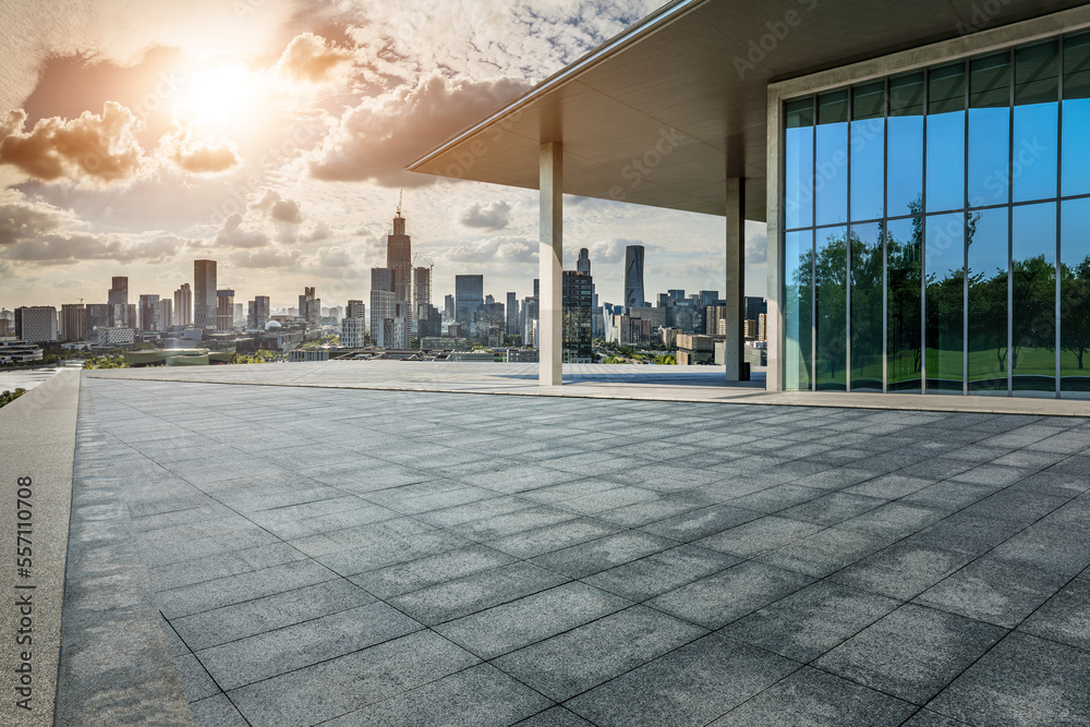 Empty square floor and modern city skyline with buildings at sunset in Ningbo, Zhejiang Province, Ch