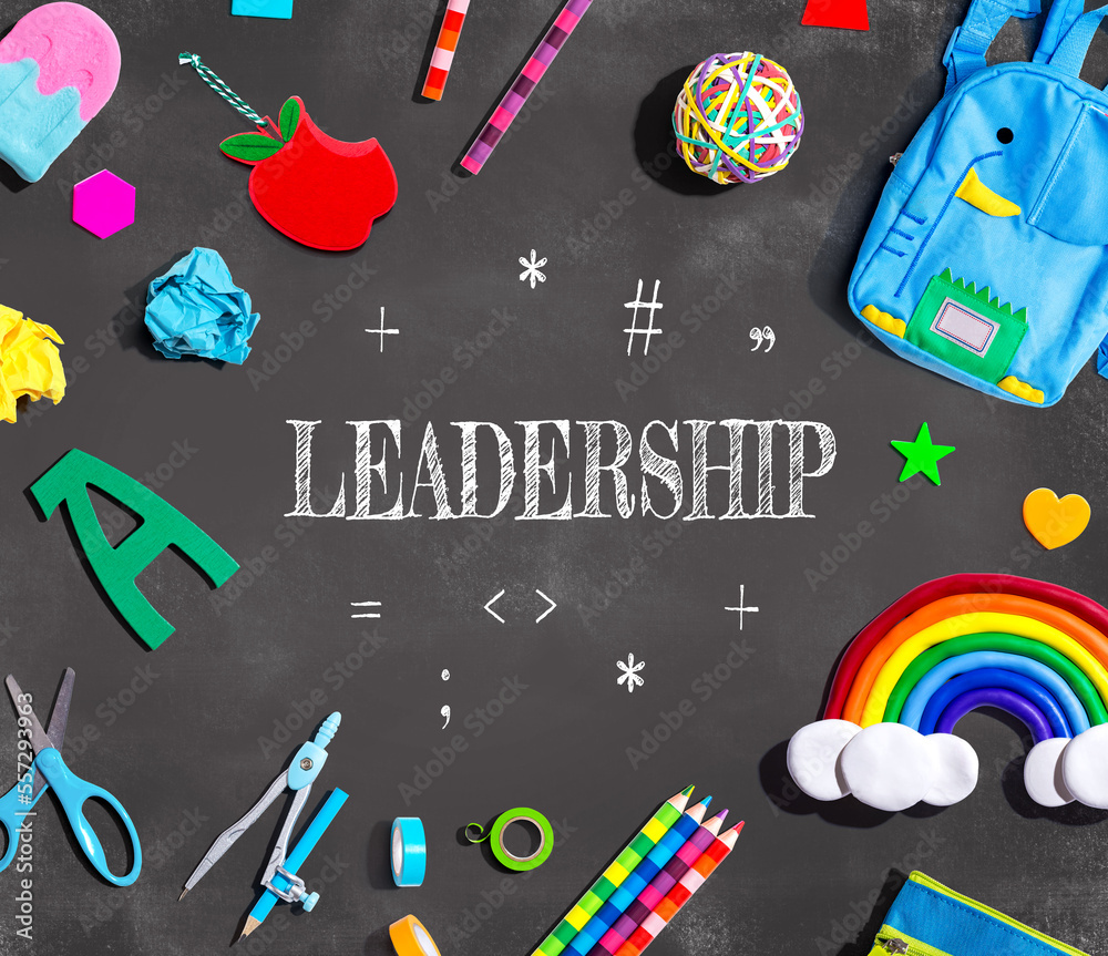 Leadership with school supplies on a chalkboard - flat lay