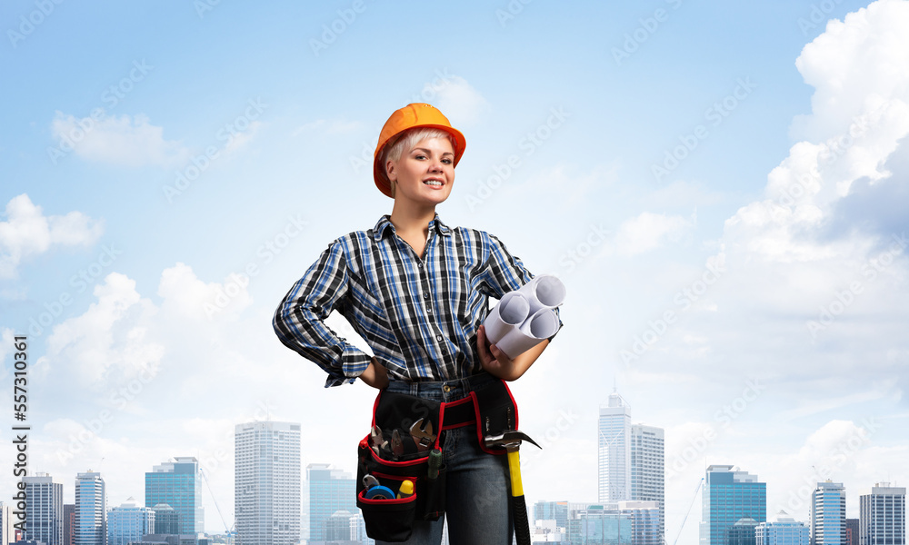 Attractive female engineer in hardhat