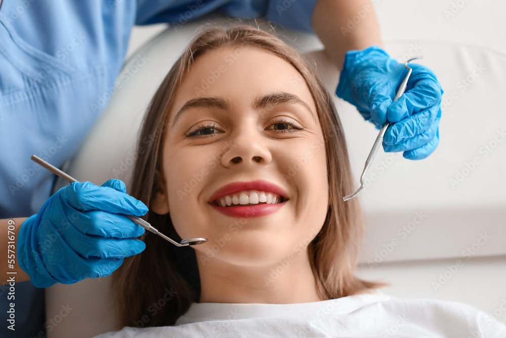 Young woman visiting stomatologist in clinic, closeup