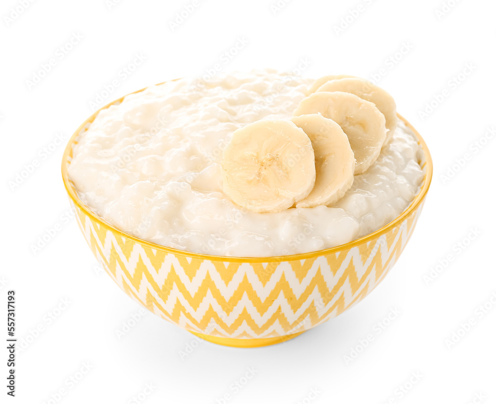 Yellow bowl with delicious rice pudding and banana slices on white background