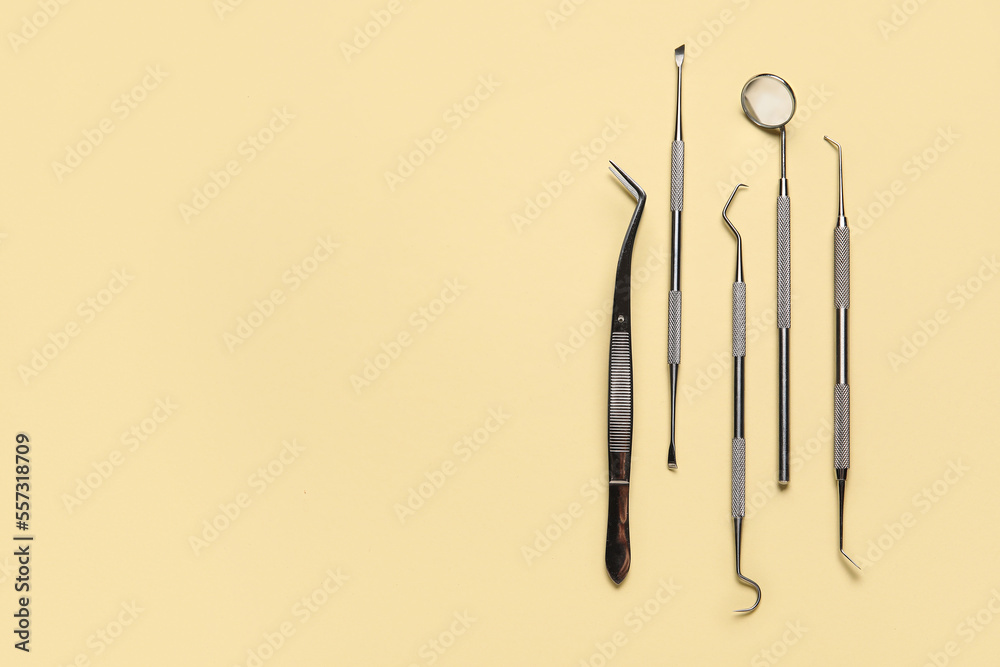 Dental tools on yellow background