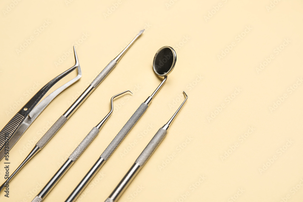 Dental tools on yellow background