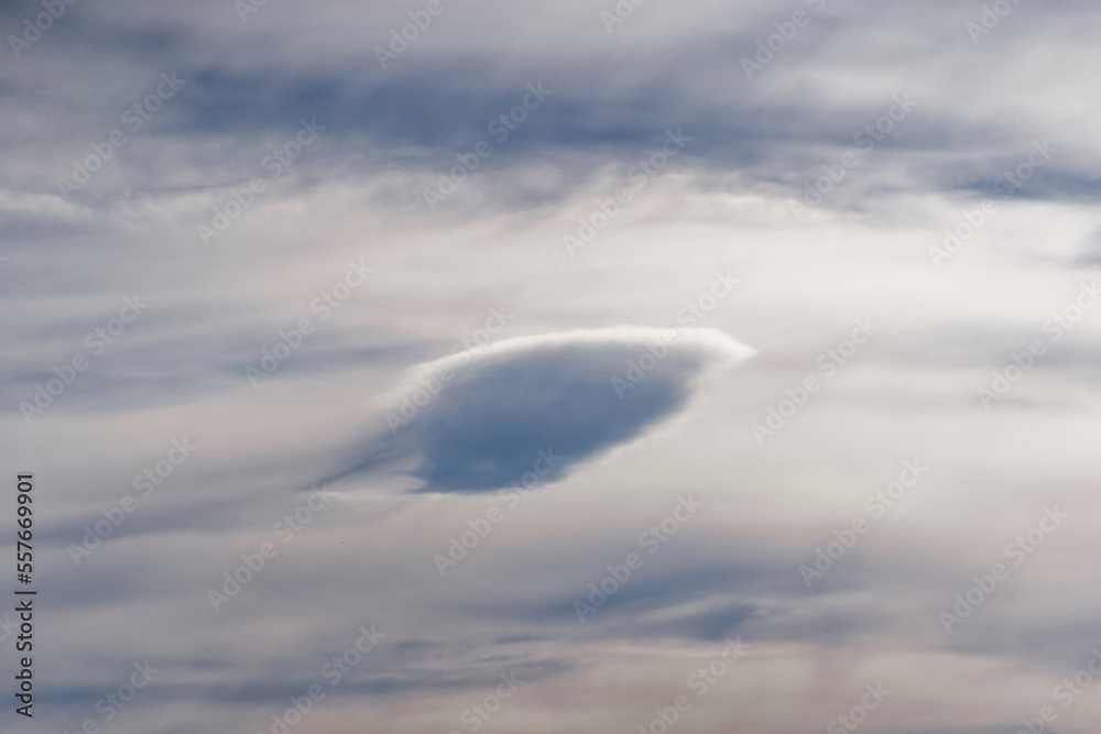 Beautiful dramatic blue cloudy autumn sky with ufo shapes cloud on an autumn afternoon. Photo taken 